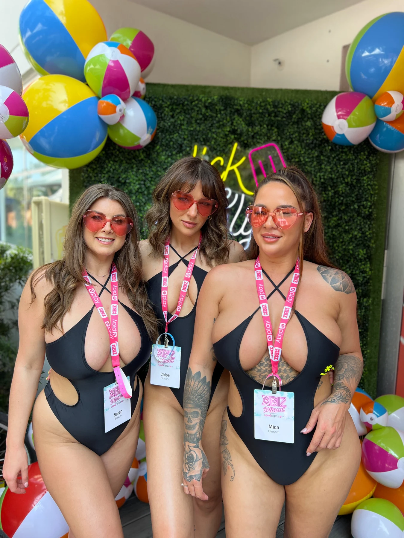 Creators with their event passes at XBIZ Miami